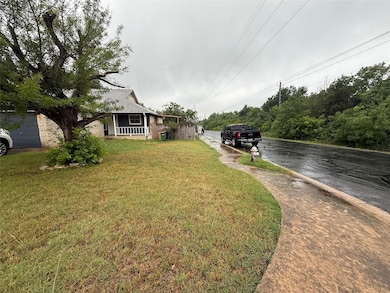 View of front of house with aphalt driveway and a