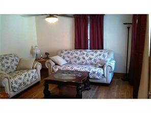 Living Room. Spacious living room with hardwood fl