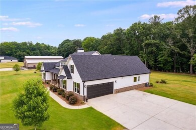 View of front of property featuring a garage and a