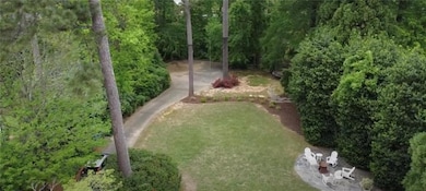 Back yard and wooded back lot fronting Peachtree D