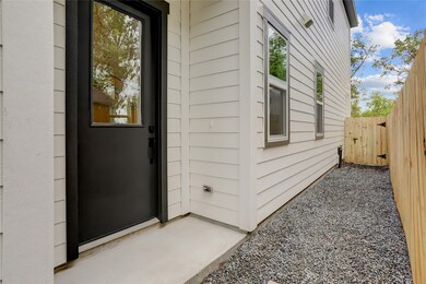 The home has a covered front entry and leaded glas