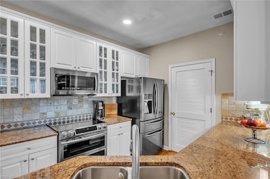 Glass cabinet doors add a touch of luxury
