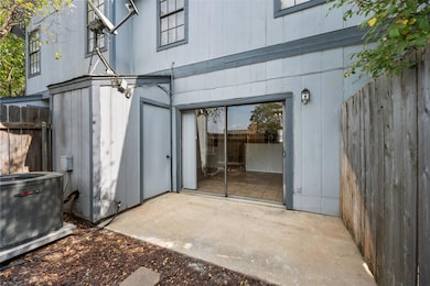 Property entrance with a patio area