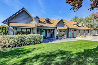 View of front of property with a front lawn, roof with shingles, a porch, and driveway