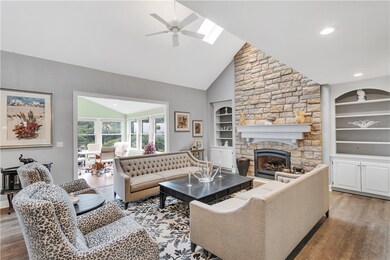 Large living room with floor to ceiling stone fire