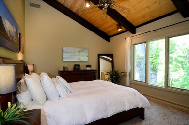 Master Bedroom: The beamed and planked ceilings co
