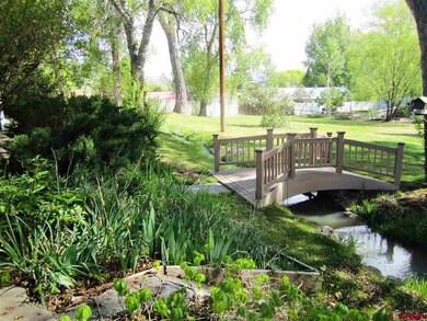 Curved Bridge in this park like yard