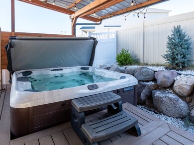 Deck featuring an outdoor hot tub