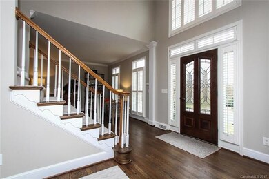 Gracious light filled Foyer opens to Formal Living
