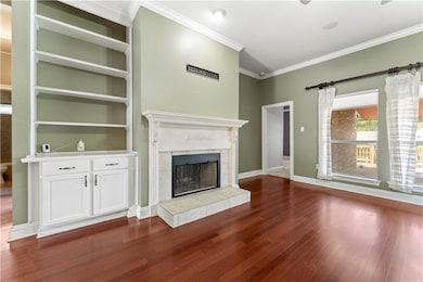 Living room. Fireplace and built-in shelves and cabinet