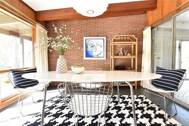 The dining room also offers a slate floor, exposed