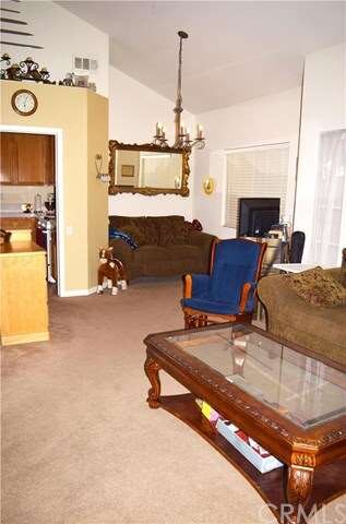 Formal living with high vaulted ceilings.