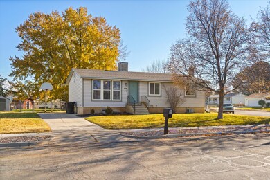 View of front of home featuring a front yard and driveway