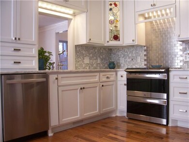 Gorgeous tile backsplash, stained glass cabinet do