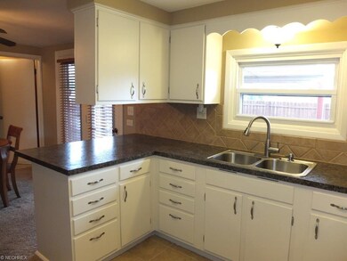 Kitchen is open to dining room.