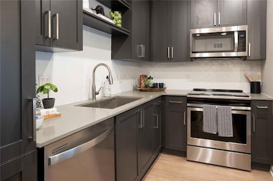 Kitchen featuring sink, stainless steel appliances