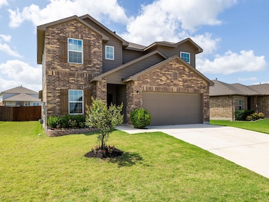 Traditional-style house featuring brick siding, a