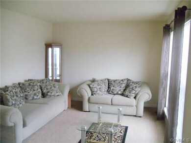 Spacious Living Room with plush carpet.