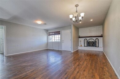 Unfurnished living room featuring dark wood-type f