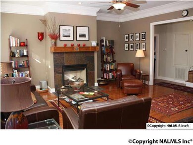 Family Room: Hardwood Floors, Gas Log Fireplace, Crown Molding.