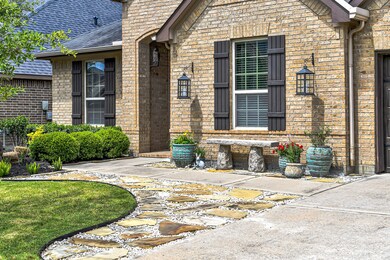 No detail is overlooked when it comes to this home! You have gorgeous oil rubbed bronze exterior lighting, an expanded flagstone walkway, lush landscaping, and a charming bench outside of your study window. Follow the sidewalk that takes you through an elegant archway that leads to your solid wood front door flanked by two transom windows!