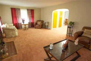View of the opposite end of the living room. Brigh