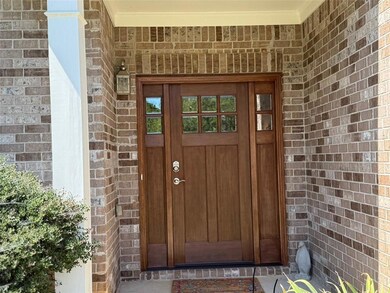 Property entrance with brick siding