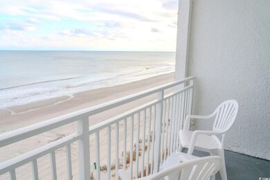 Balcony with view of water and beach