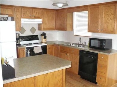 NICE SIZE KITCHEN WITH EATING BAR, GOOD CABINET SP