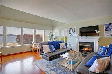 Open floorplan w/ original wood floors.