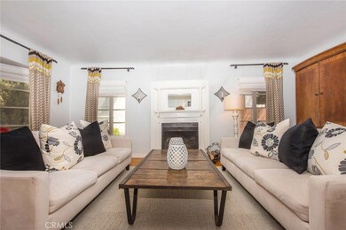 Beautiful Fireplace is the Focal Point of the Living Room.