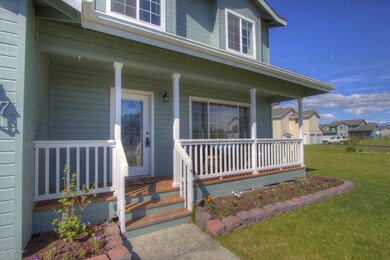 Covered front entry and flower garden