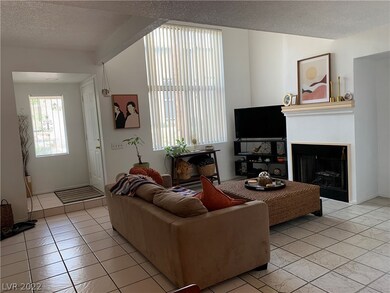FRONT LIVING ROOM WITH COZY FIREPLACE