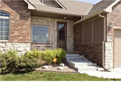Brick and stone front with covered porch