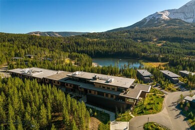 Aerial view featuring a water and mountain view
