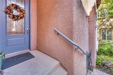 Inviting front entry with a decorative glass door and cozy porch landing—setting the tone for what’s inside.
