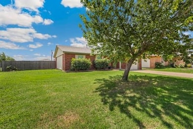 View of front of property with a garage and driveway