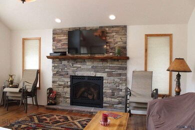 Propane fireplace dominates the living room and pr