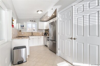 Renovated kitchen with laundry closet.