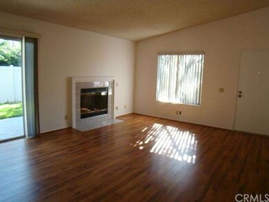 Living room with sliding doors to patio and yard. 