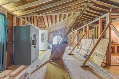 Miscellaneous room featuring lofted ceiling