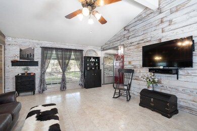 Huge den with vaulted ceiling, authentic barn wood walls & wood burning stove