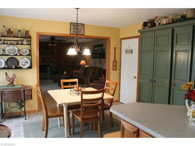 Eat-in dinette with family room beyond. Green pant
