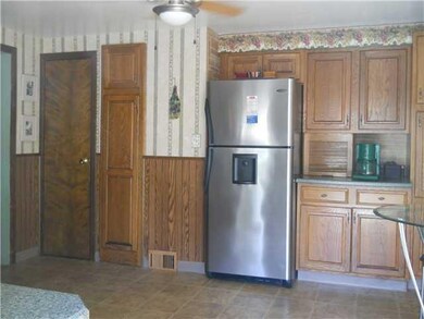 Kitchen loads of storage in the updated oak cabine