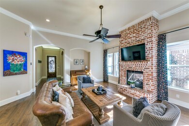 Living area with gorgeous brick fireplace.