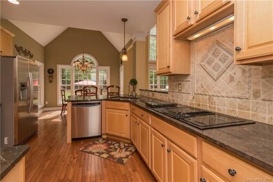 Decorative Tile and Hardwoods in Kitchen
