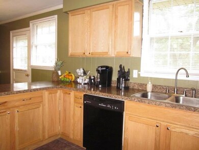 Remodeled kitchen is a warm and inviting gathering place.