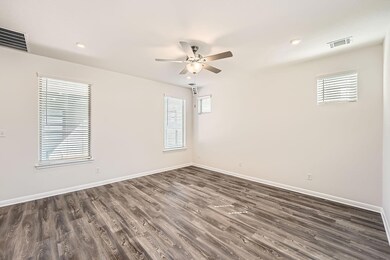 Spare room with dark wood-style flooring, a ceili