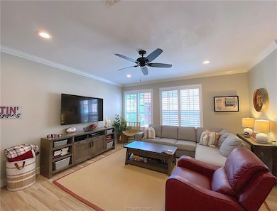 Living room featuring ornamental molding, ceiling