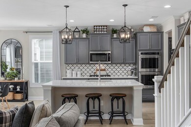 Kitchen featuring backsplash, an inviting chandeli